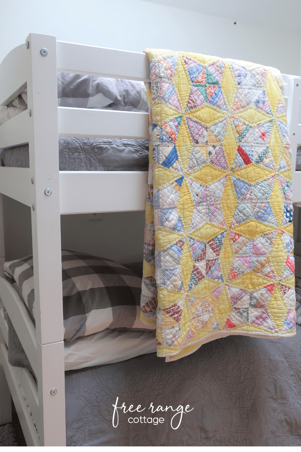 Vintage quilt and white bunkbeds farmhouse style bedroom