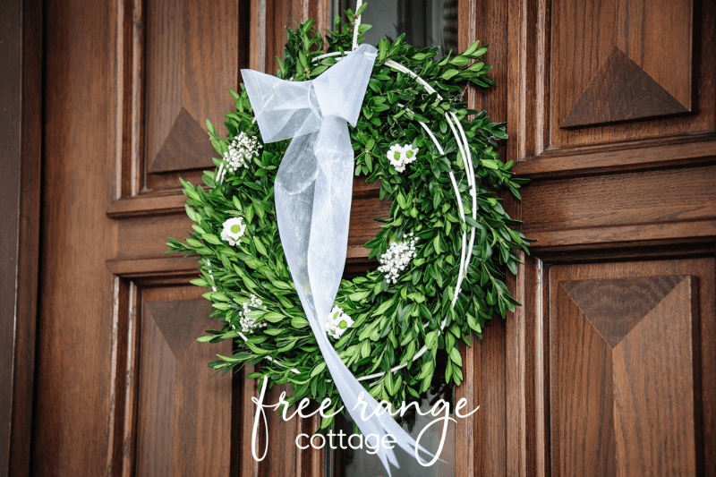 green wreath on wood door