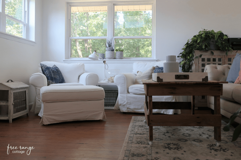 Two white slipcovered chairs