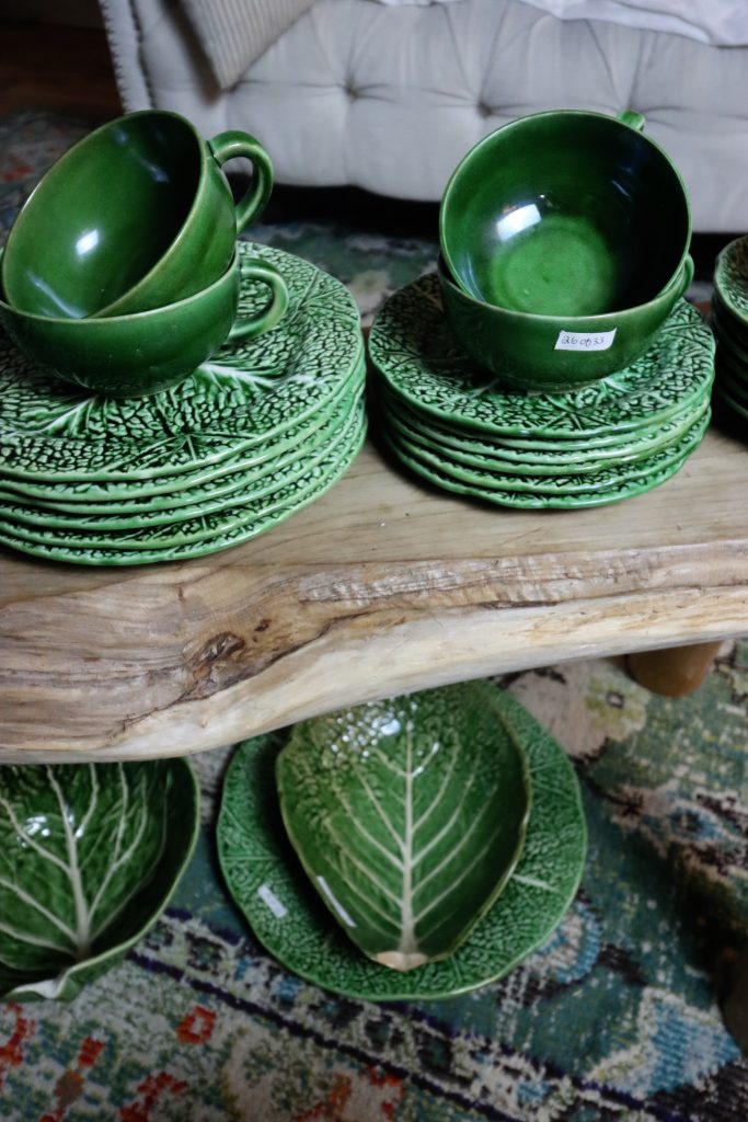 Green dishes on raw wood bench