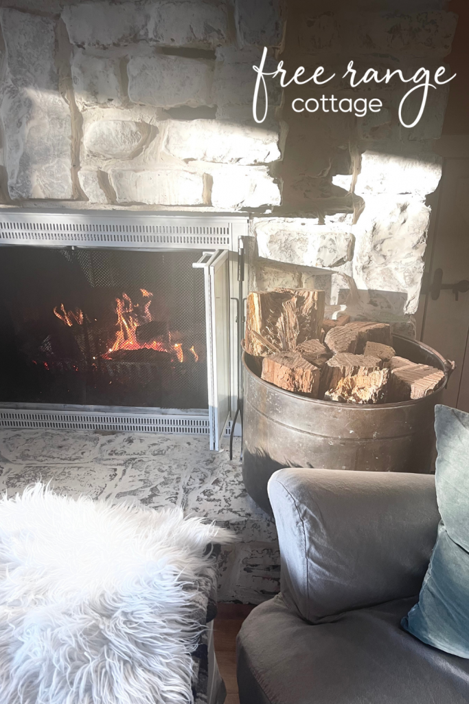 fireplace with copper pot for firewood