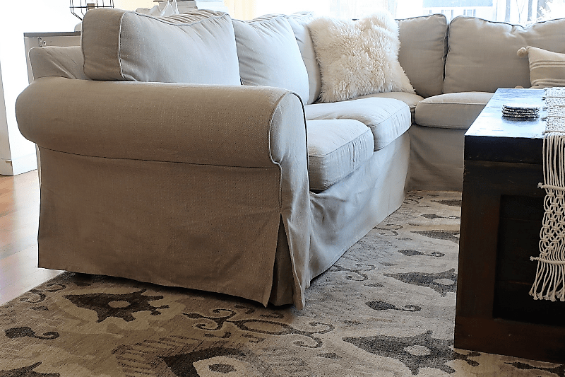 ektorp slipcovered sectional with beige slipcover and neutral rug