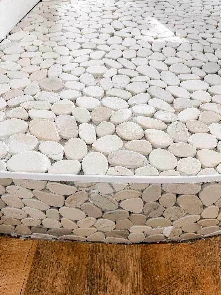 white and gray pebble floor tile