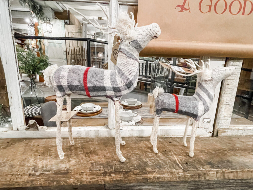 Gray and red plaid deer on table