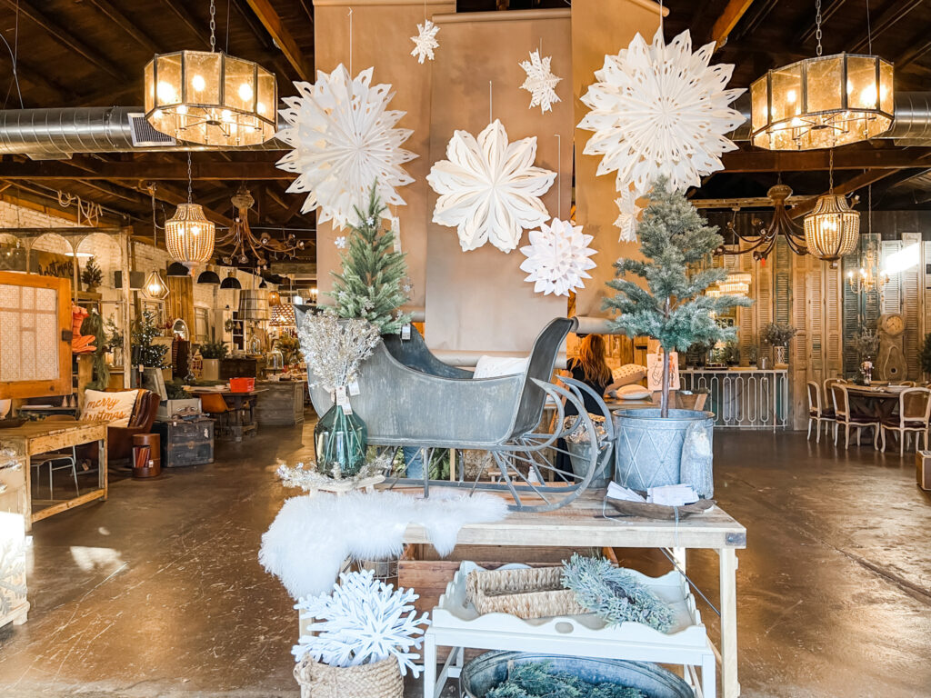 Christmas display with paper snowflakes and vintage furniture