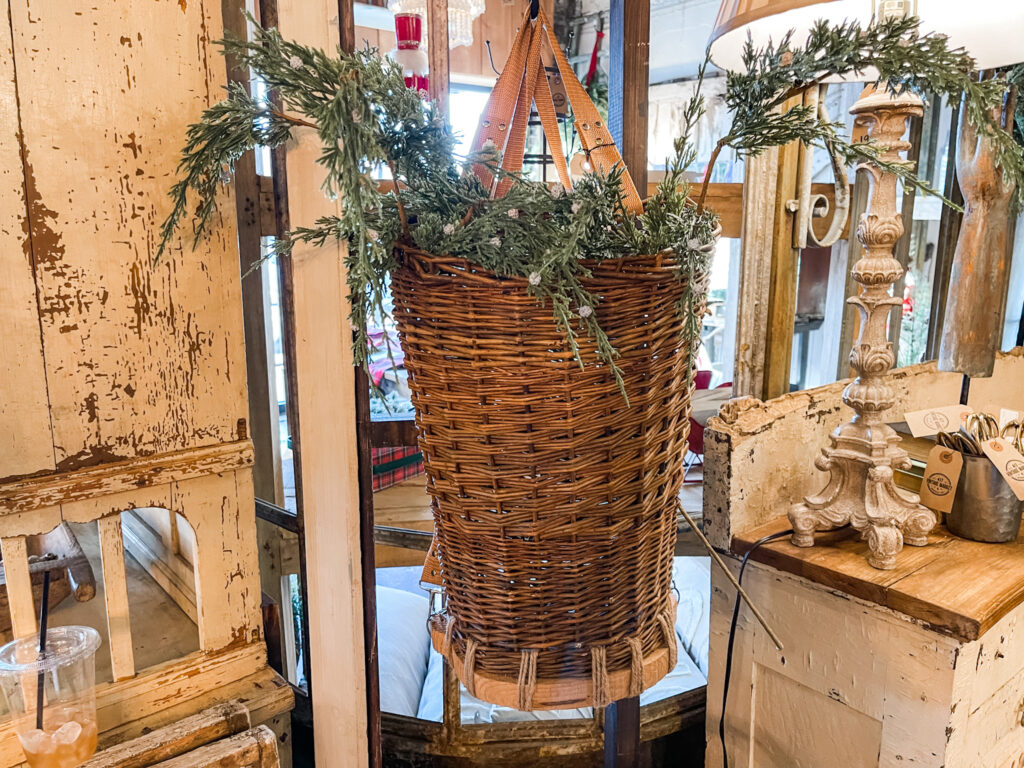 wall basket with Christmas greens in it