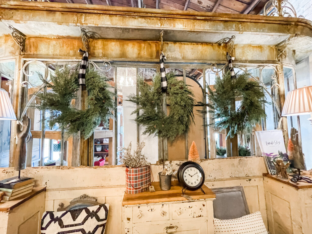 3 wreaths with black and white ribbon