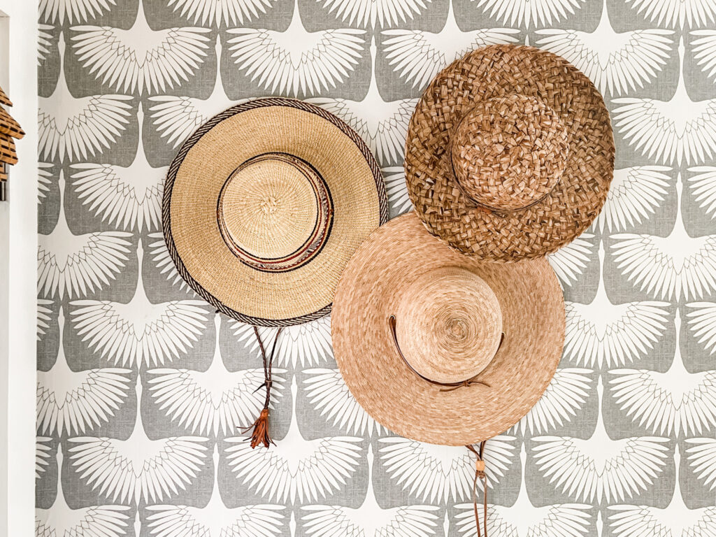 vintage hats on gray and white wallpaper