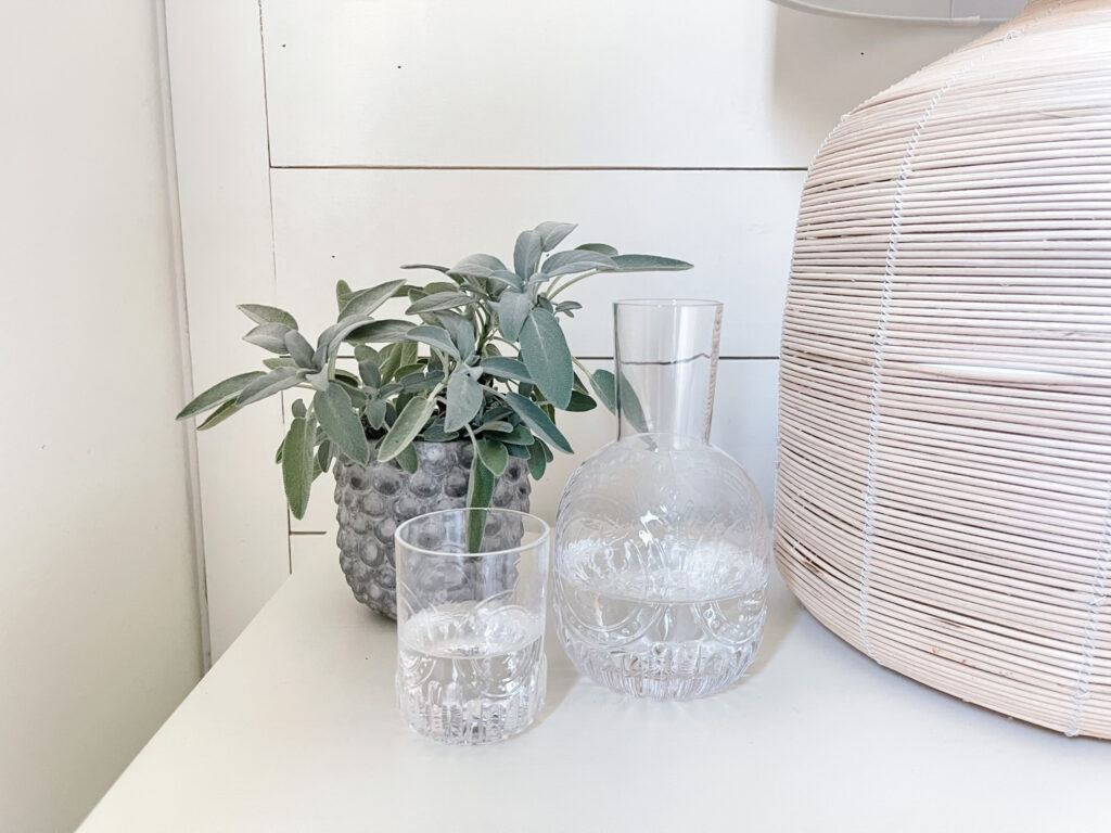 water carafe on bedside chest