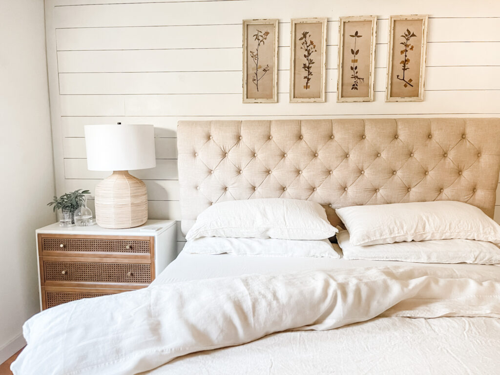 bed with duvet comforter and fluffy pillows