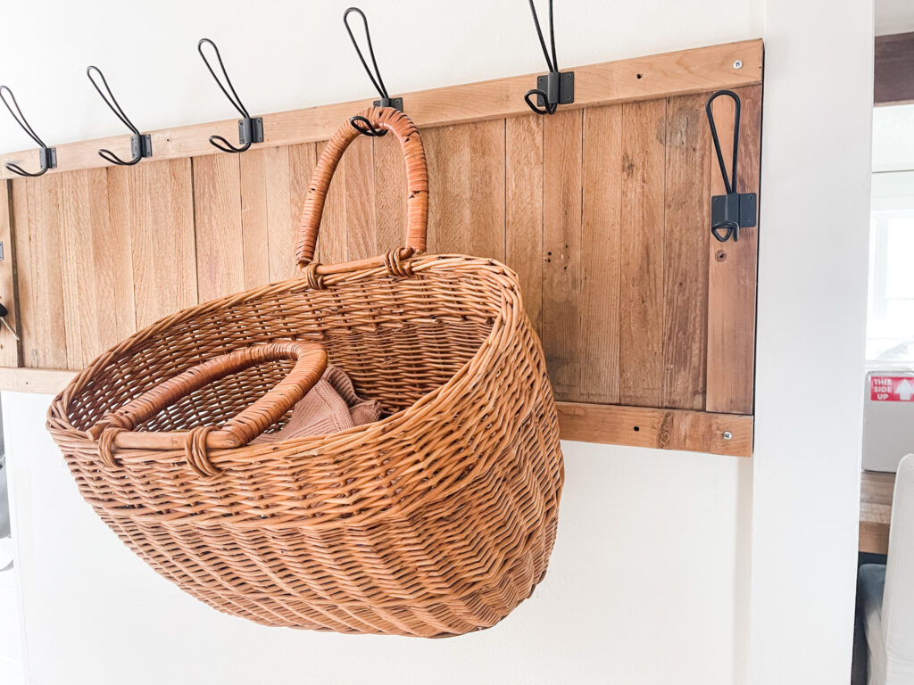 basket hanging on hook to store dog leashes